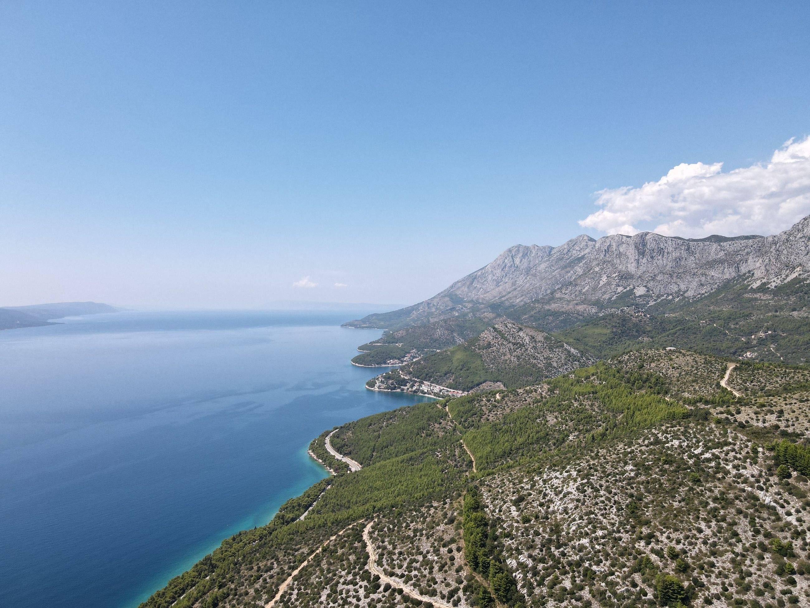 A road following the Dalmatian coastline near Podaca, between mountains and sea